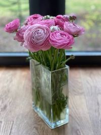 Close-up of pink flower vase on table