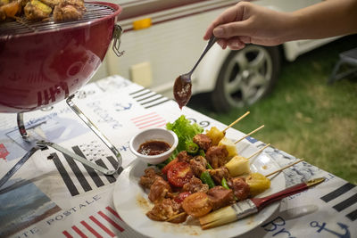 High angle view of person preparing food on table