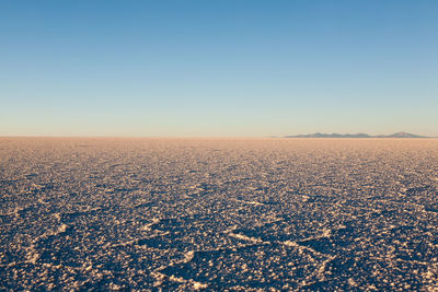 Scenic view of sea against clear sky during sunset