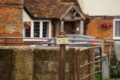 Information sign against house