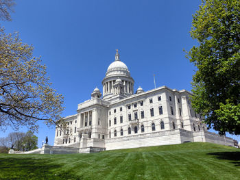 Facade of historic building against clear blue sky