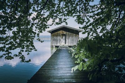 View of pier over lake against sky