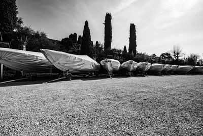 Series of motorboats and boats parked on the trolleys for transportation