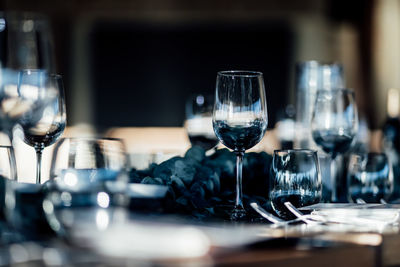 Luxury table settings for fine dining with and glassware, pouring wine to glass. 