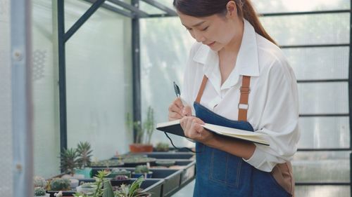 Midsection of woman working at construction site