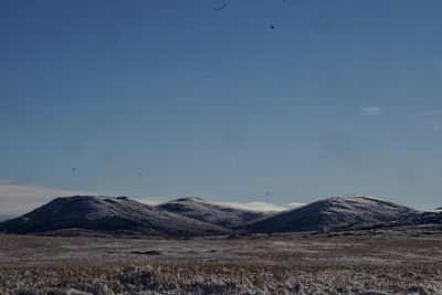 Scenic view of arid landscape against sky