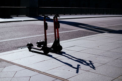 Push scooters on footpath in city