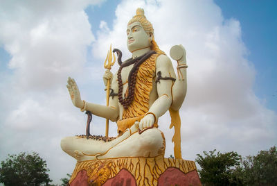 Low angle view of statue against sky