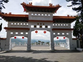 View of temple building against cloudy sky