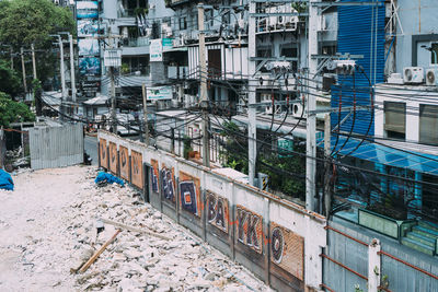 High angle view of construction site by buildings in city