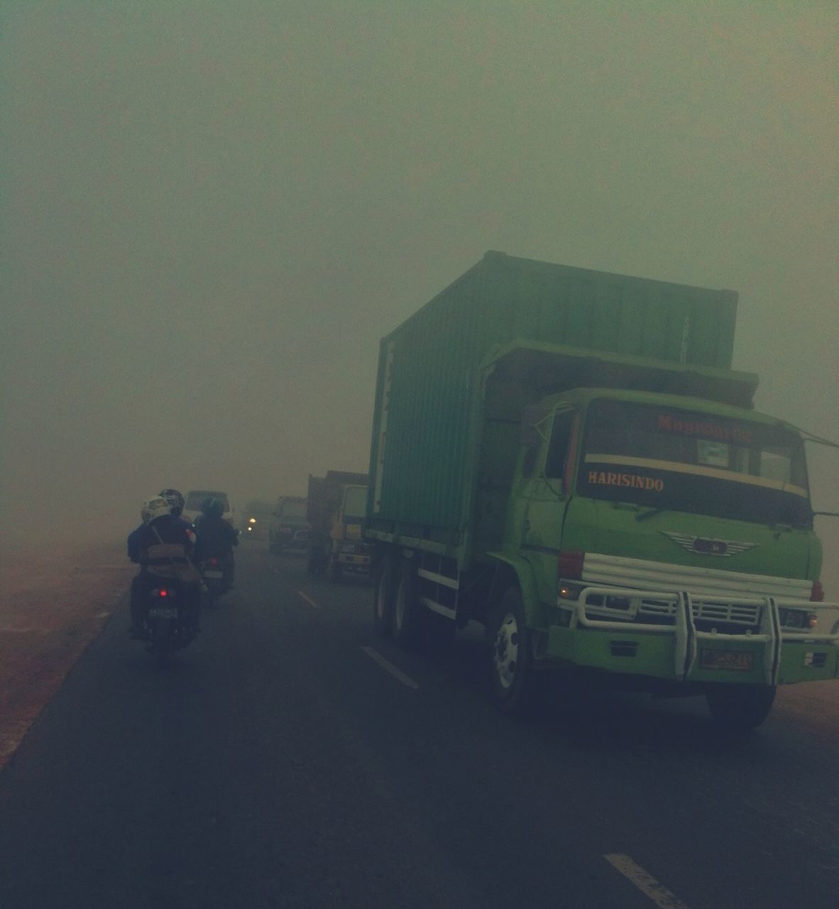 land vehicle, transportation, car, mode of transport, street, road, architecture, building exterior, built structure, on the move, copy space, stationary, travel, vehicle, city, clear sky, parking, traffic, outdoors, sky