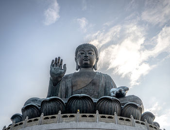 Low angle view of statue against sky