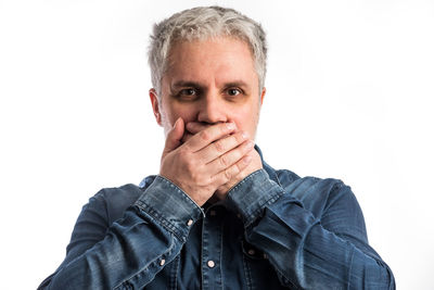 Portrait of man against white background