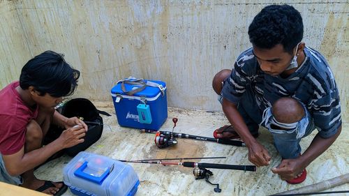 High angle view of people working on table