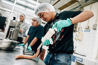 People working in kitchen