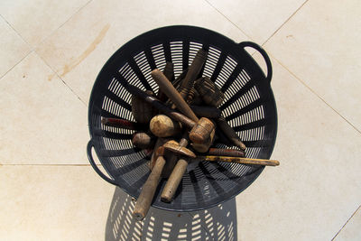 High angle view of woman holding wicker basket