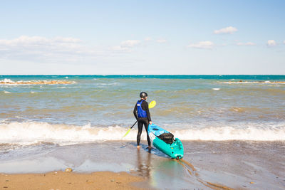 Full length of man on beach against sky