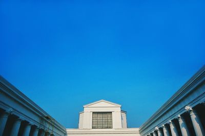 Low angle view of building against clear blue sky