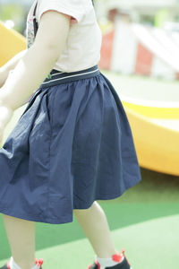 Low section of woman with yellow legs