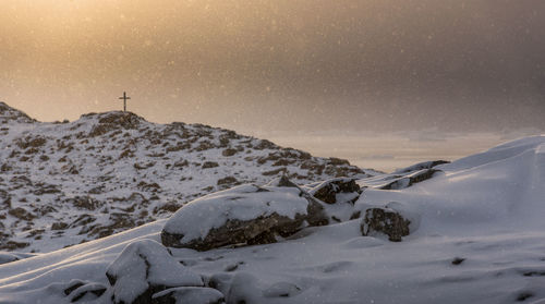 Scenic view of snow covered mountains against sky