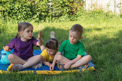 Happy children talking in the park on a summer day. communication of preschoolers. 