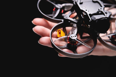 Close-up of hand holding headphones