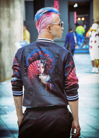 Rear view of man standing on street