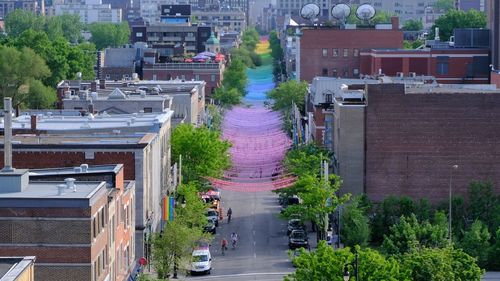 High angle view of street amidst buildings