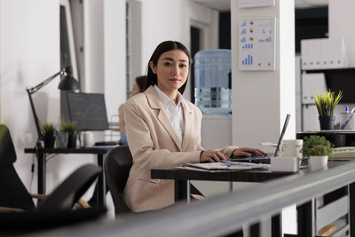 Portrait of businesswoman using digital tablet