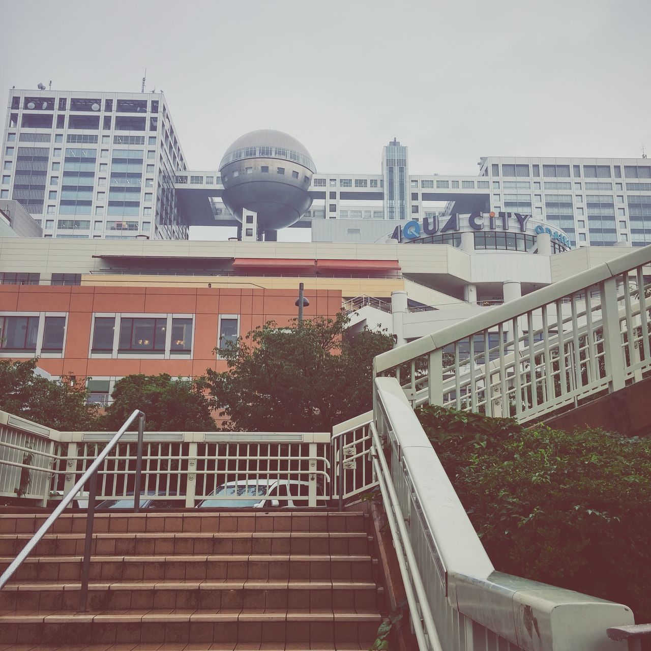 architecture, building exterior, built structure, railing, city, building, clear sky, residential building, residential structure, window, low angle view, day, steps, sky, outdoors, glass - material, staircase, city life