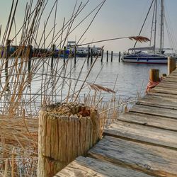 View of wooden pier at harbor