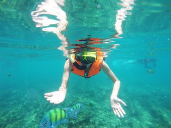 Woman snorkeling underwater at sea