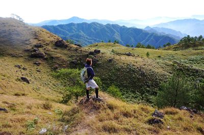 High angle view of man hiking on mountain