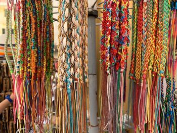 Multi colored flags hanging at market stall