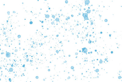 Close-up of bubbles against white background