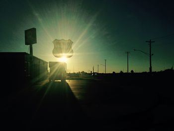 Street light against sky at sunset