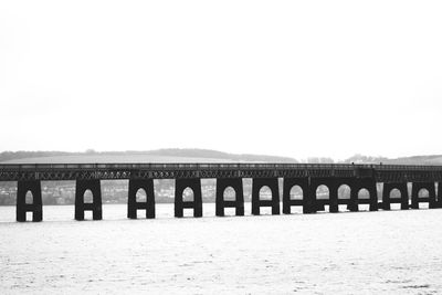 View of bridge over sea against clear sky