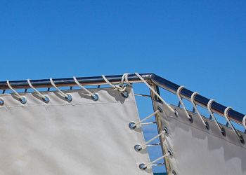 Close-up of boat canvas against clear sky