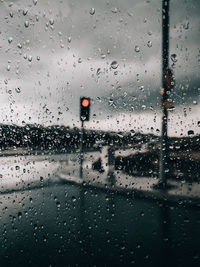 Full frame shot of wet glass window in rainy season