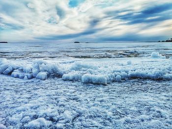 Scenic view of frozen sea against sky