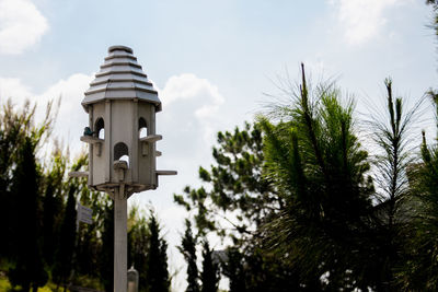 Low angle view of birdhouse against sky