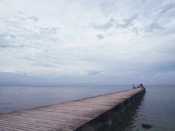 Pier over sea against sky