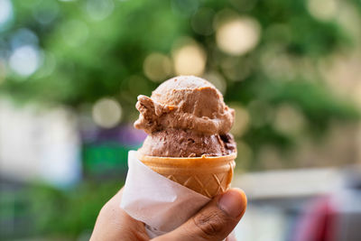 Hand holding ice cream cone