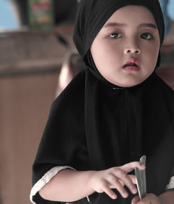 Portrait of young woman using mobile phone