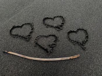Directly above shot of heart shape on sand