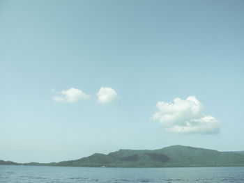 Scenic view of sea against blue sky