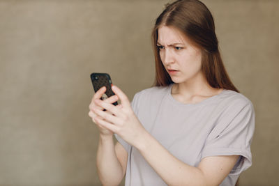 Young woman using mobile phone