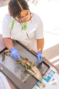 High angle view of woman holding fish