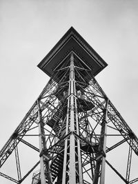 Low angle view of communications tower against sky