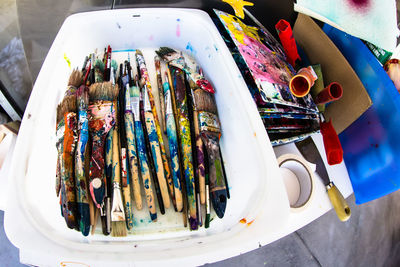 Close-up of paintbrushes in container